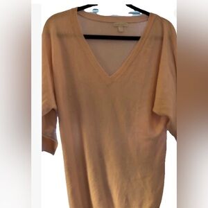 Two V-neck, NY&Co long sweaters with half-sleeves, one pink and one maroon.